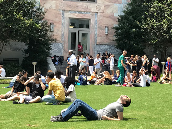 TOTALITY 2017: Medical students view the August solar eclipse on the front lawn of the Emory School of Medicine—safely, of course. 