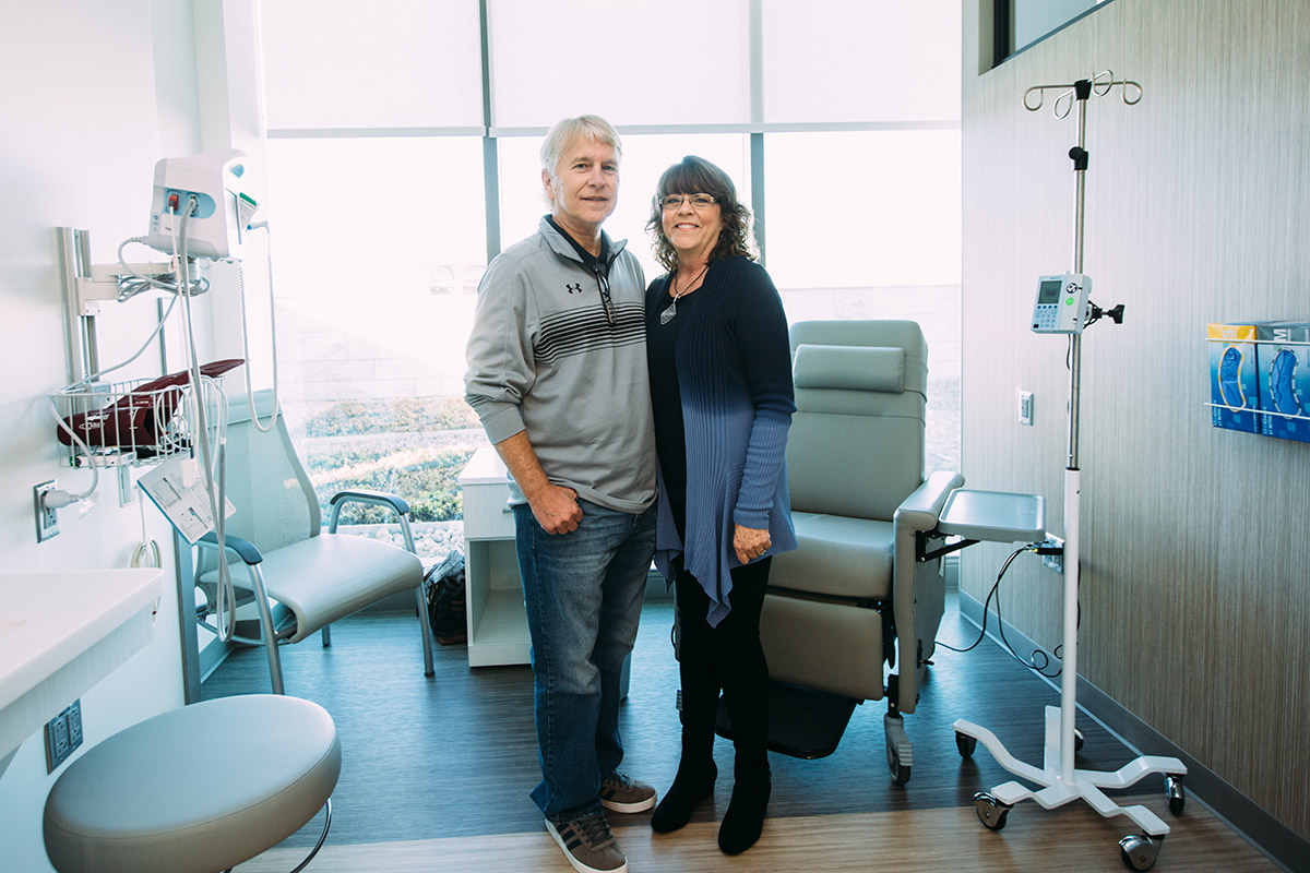 Couple standing in a cancer clinical trials center