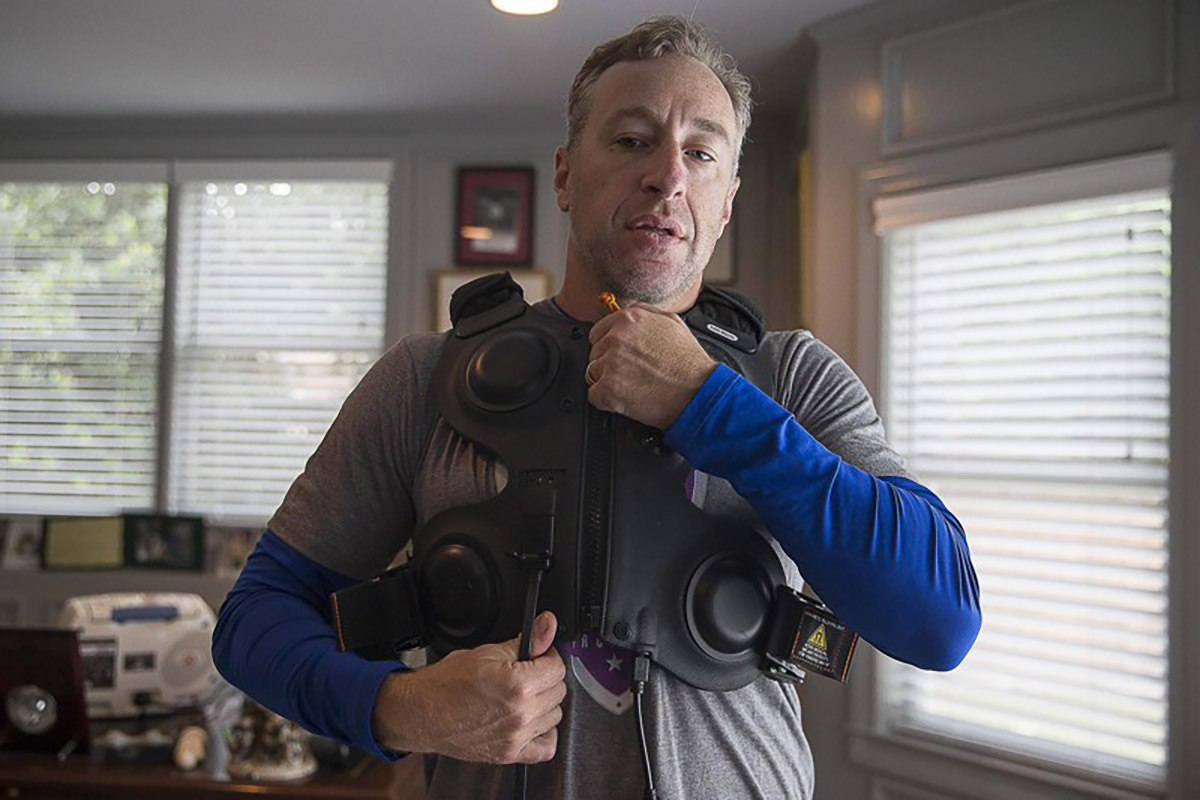 Andy Lipman, wearing the percussive vest used to ease his breathing.